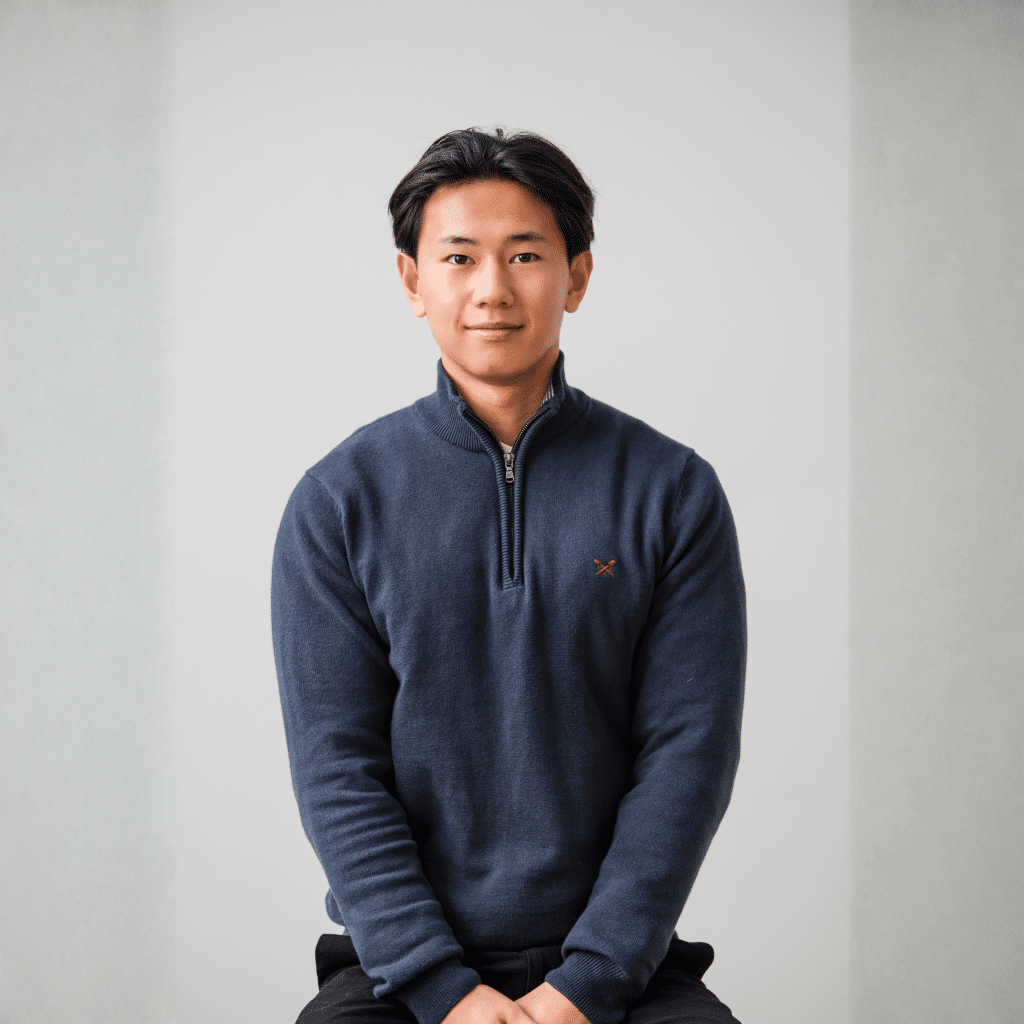 Josh, SEO Specialist at nu media group, in a navy jumper against a light background